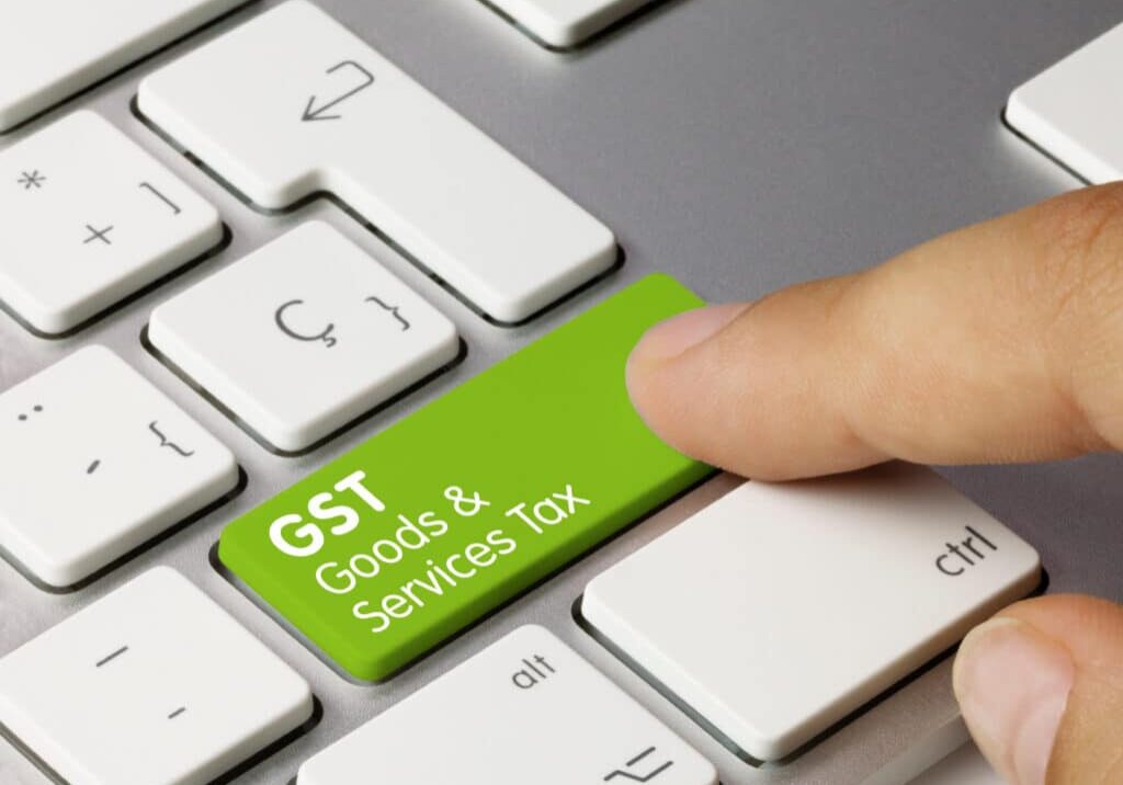 GST Goods and Services Tax Inscription on Green Keyboard Key