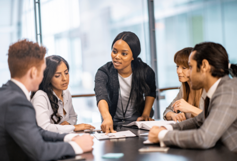 businesswoman in a meeting wondering: am I a good leader?