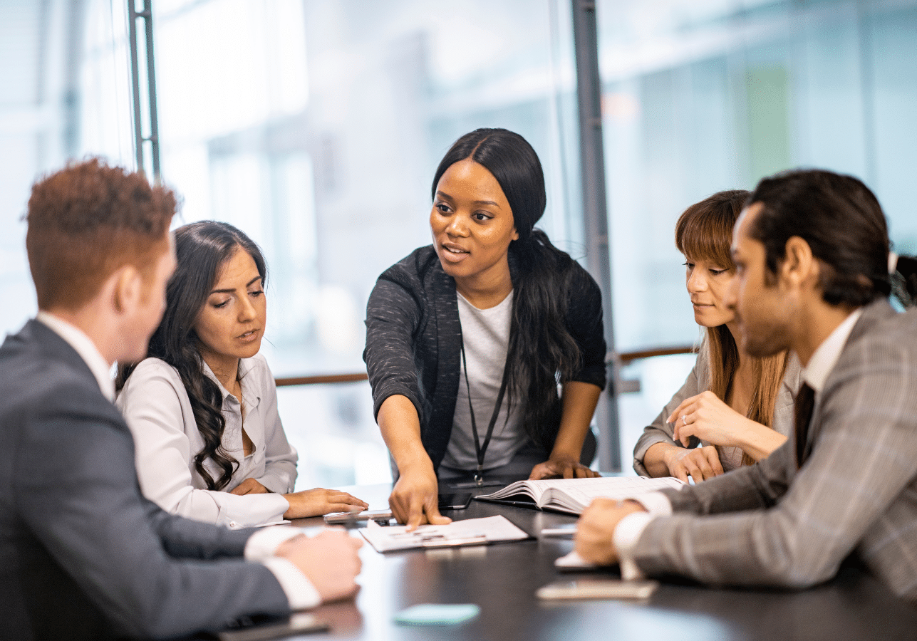 businesswoman in a meeting wondering: am I a good leader?